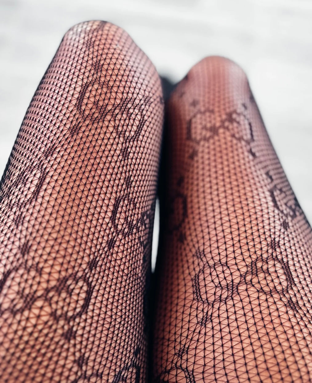 GG fishnet stockings